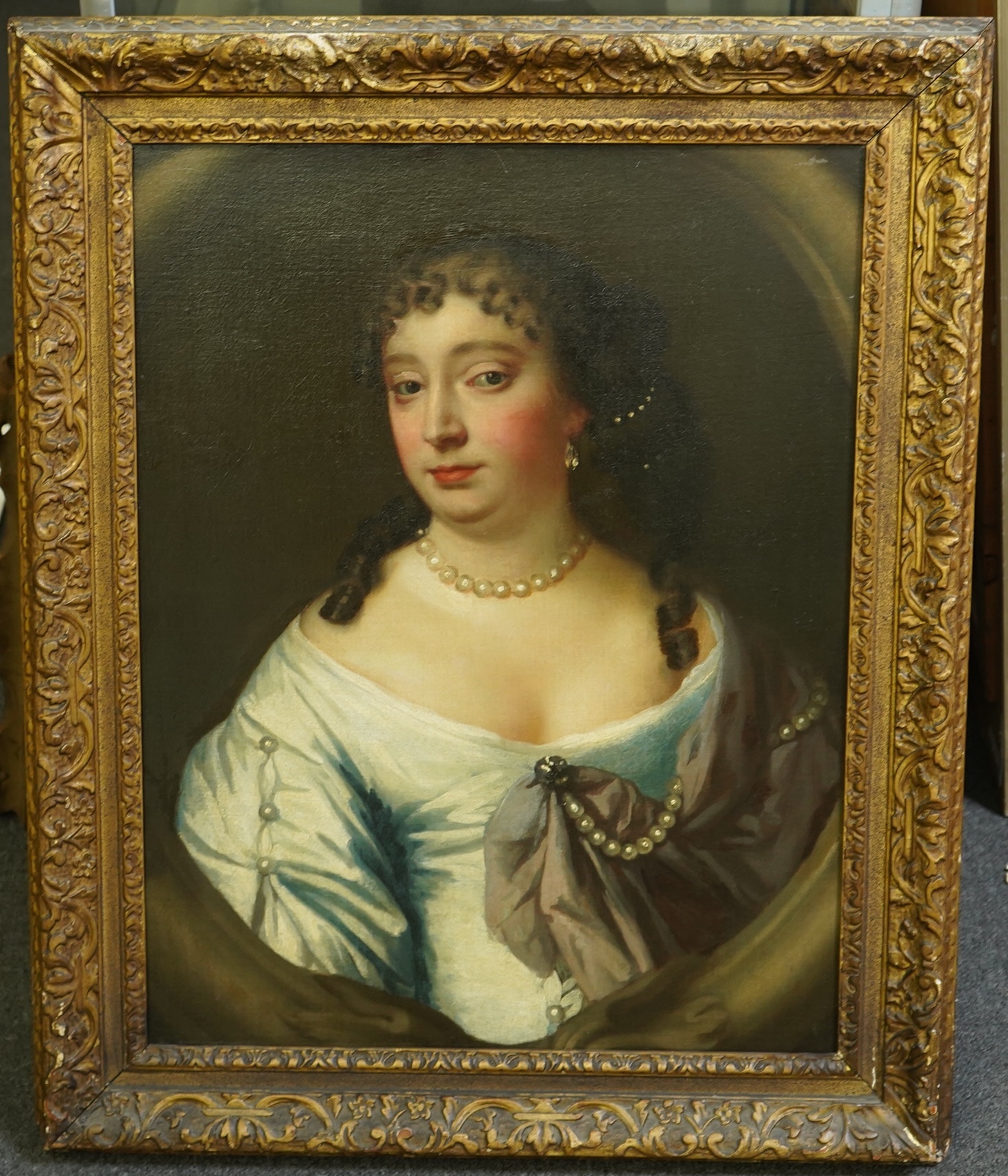 After Sir Peter Lely (1618-1680), Portrait of daughter of the Earl of Clarendon, Anne (Hyde), Duchess of York. Wife of James, Duke of York, wearing a pale blue dress and pearl jewellery, oil on canvas, 68 x 52cm